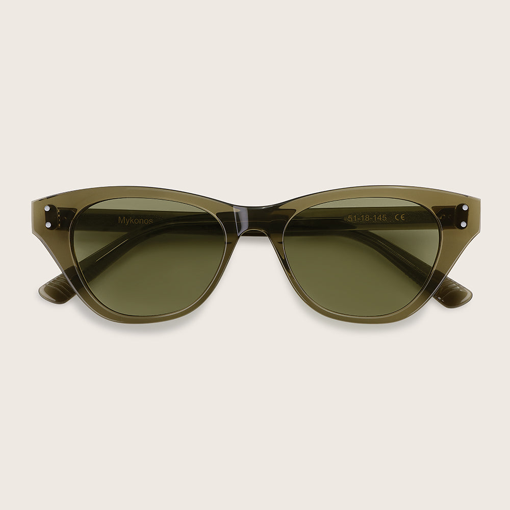 Green sunglasses with a beige background