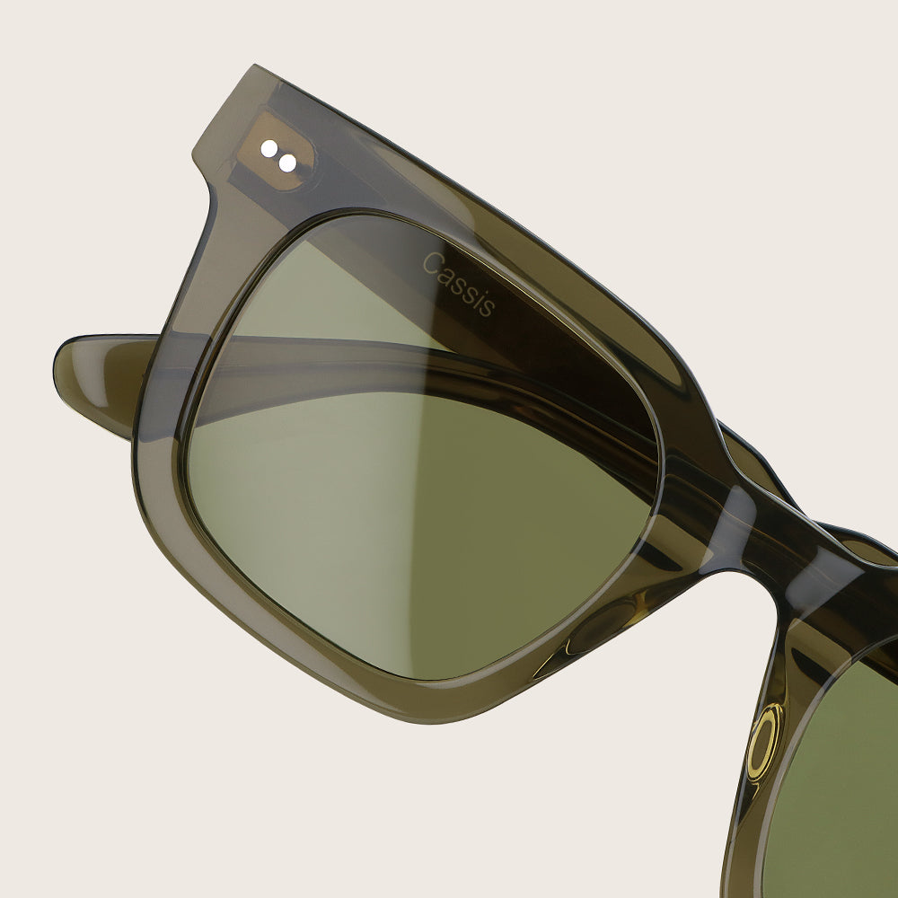 Sunglasses with a brand name on a beige background