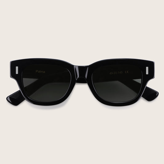 Black sunglasses with a brand logo on a light beige background